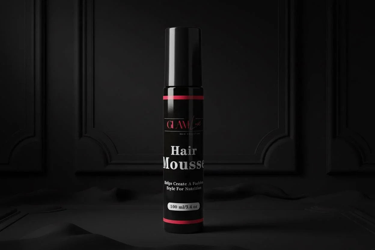 Glam Luxe Hair Collection hair mousse bottle with pump dispenser, white and gold packaging, on a neutral background.