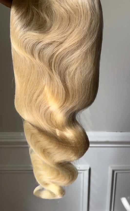 Glam Luxe Hair Collection 613 Body Wave virgin hair bundle with loose, wavy texture highlighted in natural blonde color